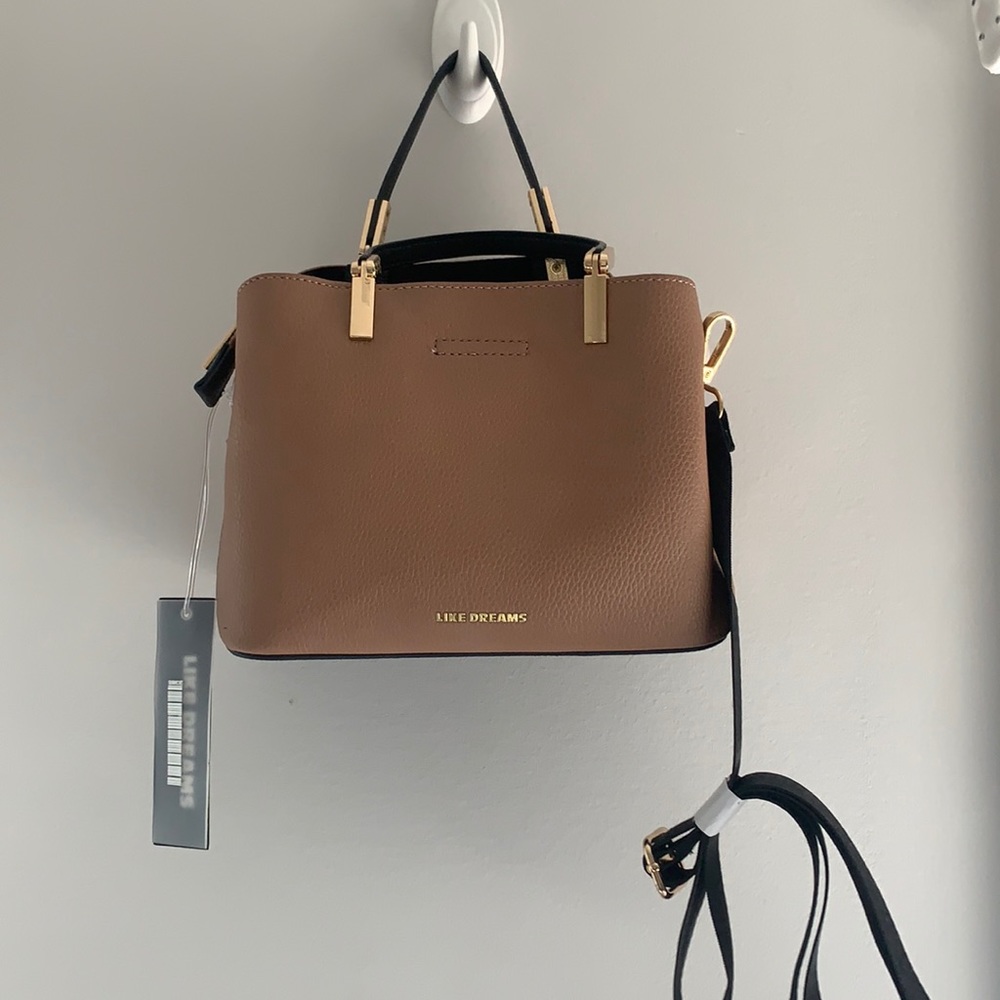 Brand new Like Dreams hand bag. Has longer strap option and hand held option.